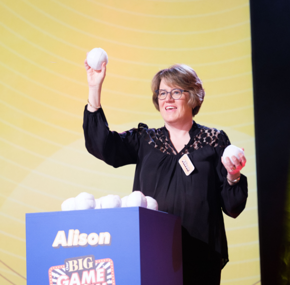 A woman throwing balls as part of the Nationwide Our Big Night In Awards.