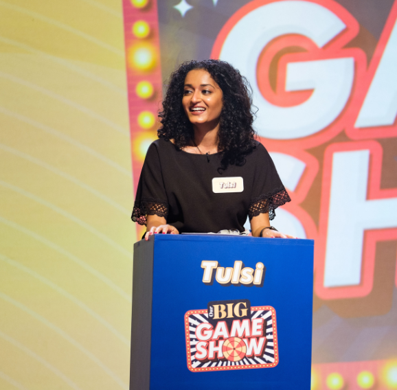 A woman behind a podium as part of the Nationwide Our Big Night In Awards.