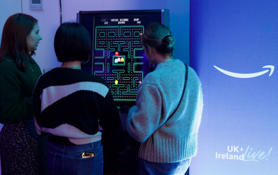 People playing Pacman at the Amazon UK & Ireland Event