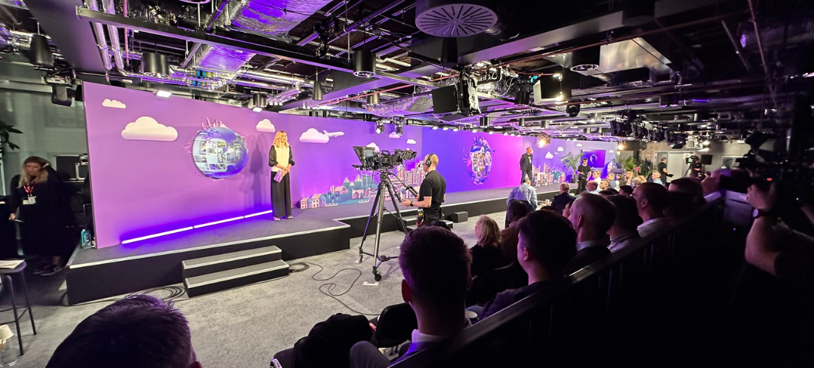 Shot of someone presenting on a stage at BT Live