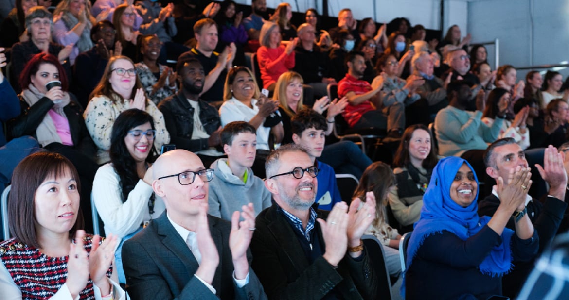 Shot of audience clapping at the Birmingham 2022 Commonwealth Games Volunteer Orientiation Broadcast.