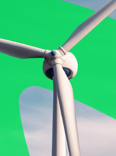 Wind turbine in front on a green pattern mixed with the blue sky 
