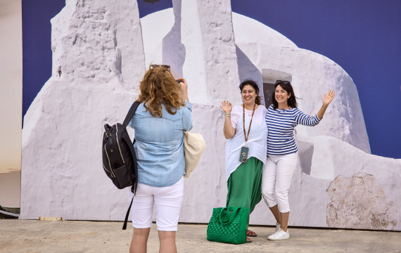 Group shot of a Vorwerk employee taking a picture of two other employees during the Mykonos incentive trip.