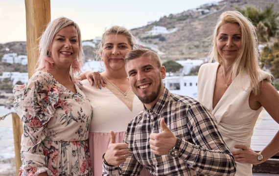 Group shot of Vorwerk employees at Hippie Fish restaurant during the Mykonos incentive trip.