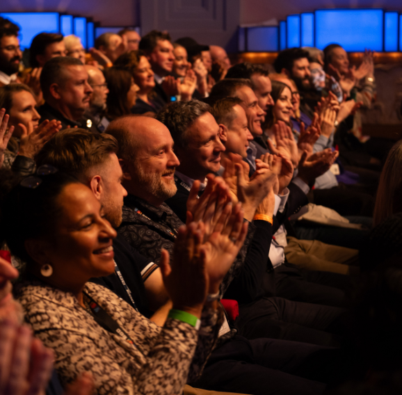 Audience clapping.