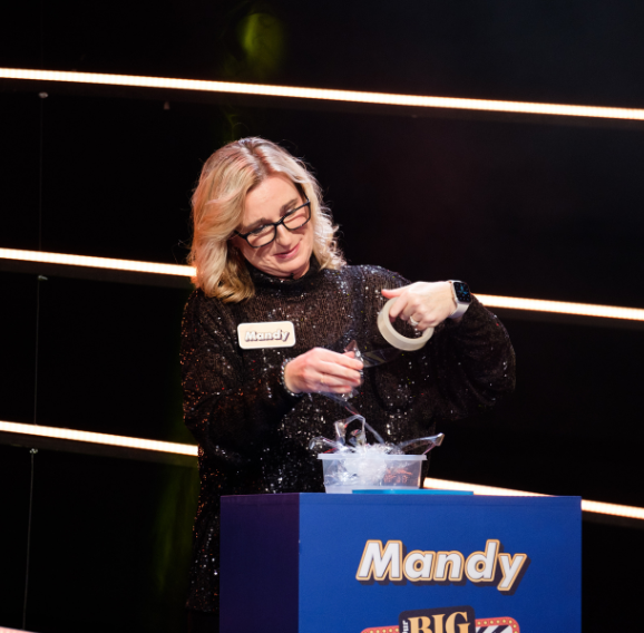 A woman holding sellotape as part of the Nationwide Our Big Night In Awards.