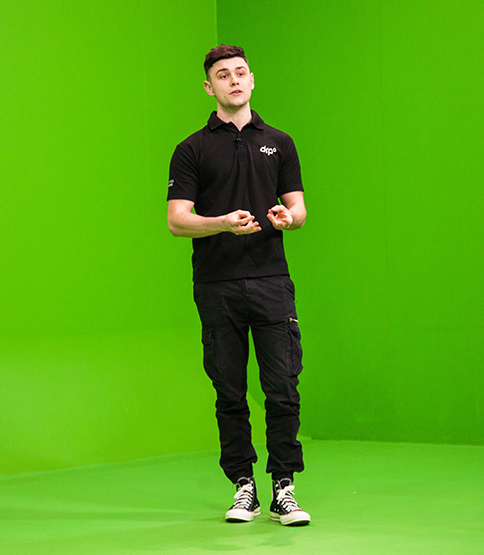 A team member rehearsing in one of our green-screen studios