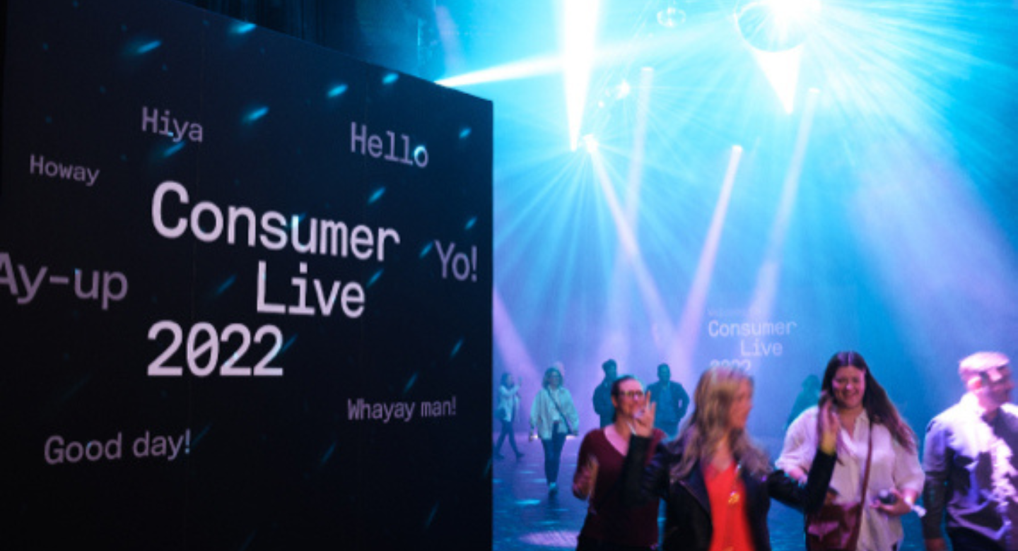 Stage with speaker and the screen holding BT Welcome slide