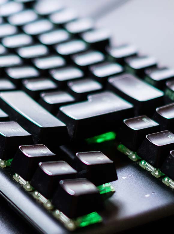 A closeup of an illuminated computer keyboard