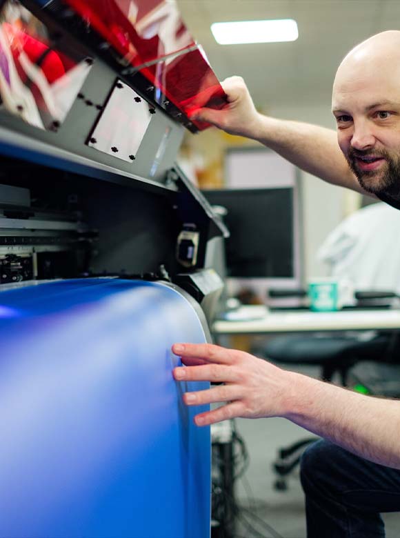 a person using a print machine